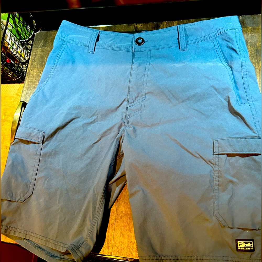 Pelagic Black Hybrid Cargo/Swim Shorts Size 32” waist 9” Inseam VGC Blue
